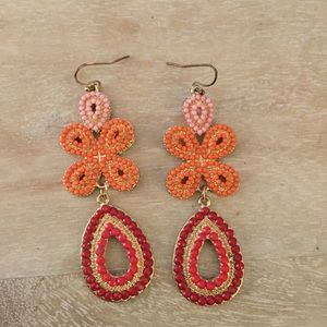 Pink, red, and orange dangle earrings set in gold